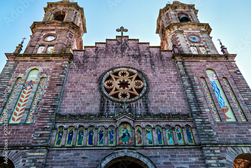 Church of Santiago, Neo-Gothic from 1916 with a well-maintained garden park at the entrance in Elizondo, Navarra, Spain