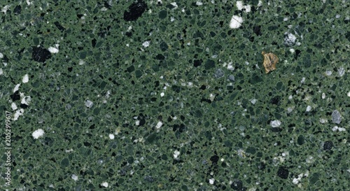 Deep green granite stone texture with black white and gold mineral flecks for background.