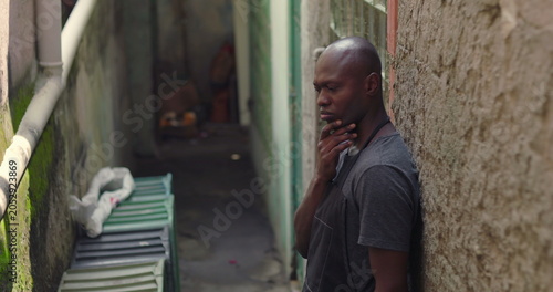 Foto Florist thinking deeply in narrow alley, small business owner standing outdoors