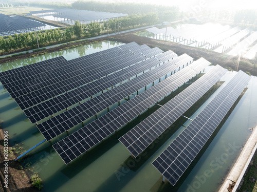 фотографія floating solar panel array for renewable energy generation on water surface