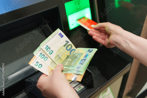 Принти на полотні Euro banknotes withdrawn from ATM while payment card remains inserted
