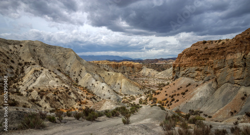 Beautiful landscape of canyon and mountains on background dramatic sky, Tabernas, Almeria, Spain