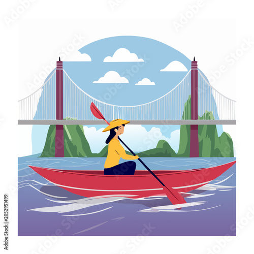 Woman kayaking on water under a bridge with mountains