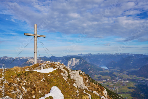 A cross from the top of the mountain Hoher Sarstein. Beautiful landscape. Salzkammergut region, Bad Goisern, Austria.