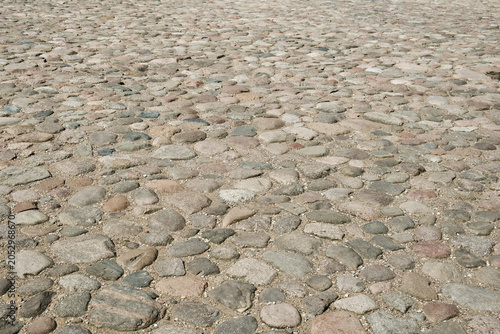 Quadro em tela Abstract background of an old cobblestone pavement