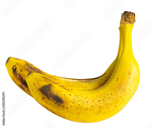 Ripe bananas with brown spots, isolated on white