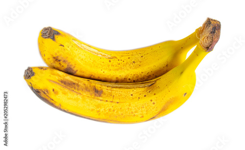 Two bananas with dark speckles, clean white background