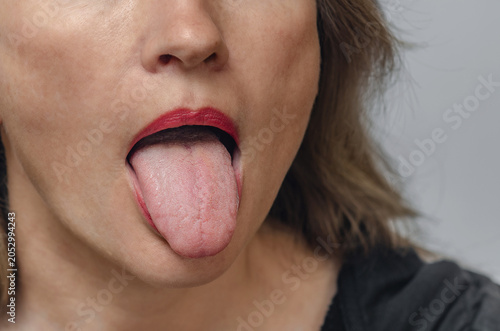 Photos Adult woman with open mouth showing tongue