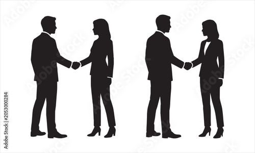 Silhouettes of business people shaking hands