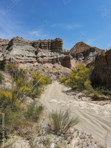 Desert canyon landscape in Granada Geopark with colorful cliffs