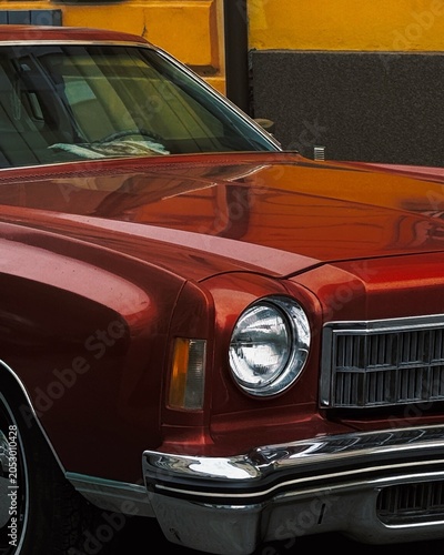 vintage red car headlight on the street 