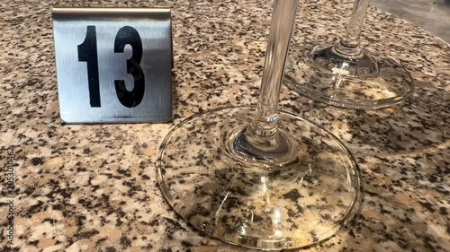 Glasses on a reserved restaurant table number 13