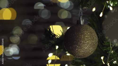 Christmas spruce tree decorated with balls and toys. New Year celebration. Closeup