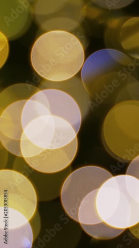Abstract background with defocused blinking lights. Vertical footage