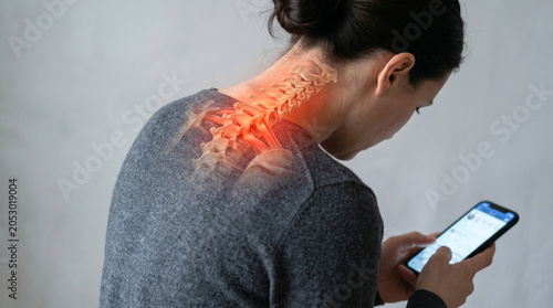 Woman with neck pain from smartphone.