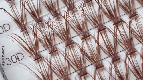False eyelashes extension set with brown lashes, closeup. Makeup accessories