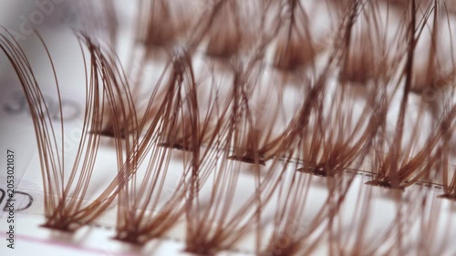 False eyelashes extension set with brown lashes, closeup. Makeup accessories
