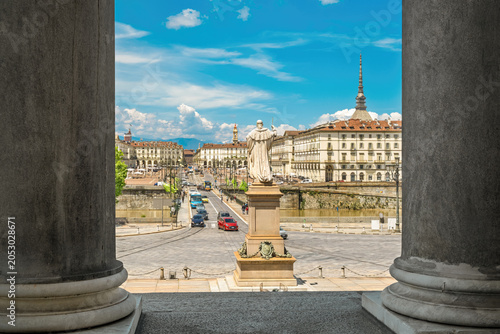 Turin cityscape with Mole Antonelliana framed by columns of Gran Madre di Dio church in Turin, Italy