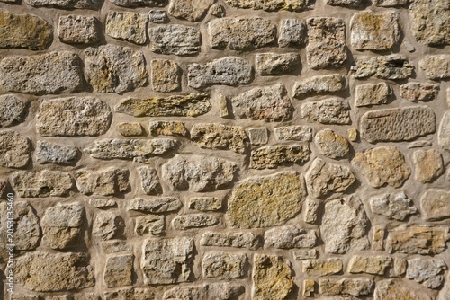 Alte beige-gelbe Backsteinfassade als Hintergrund