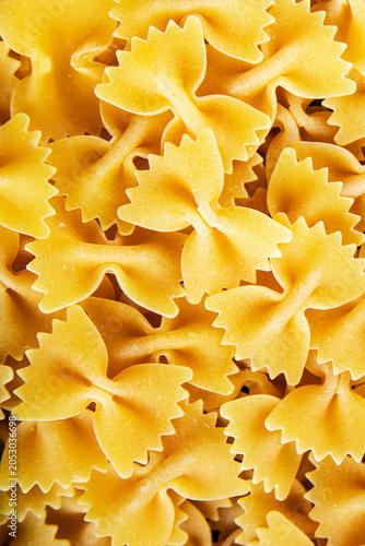 Fresh pasta farfalle durum wheat ready to cook tasty snack fresh and delicious gourmet food background on the table  rustic food top view copy space
