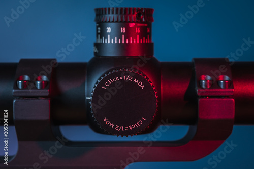 Photos Close Up of Optical Rifle Scope Adjustment Turrets under Neon Light, Precision F