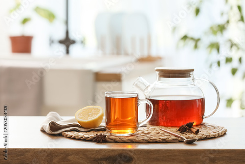 Glass cup of hot black tea ...