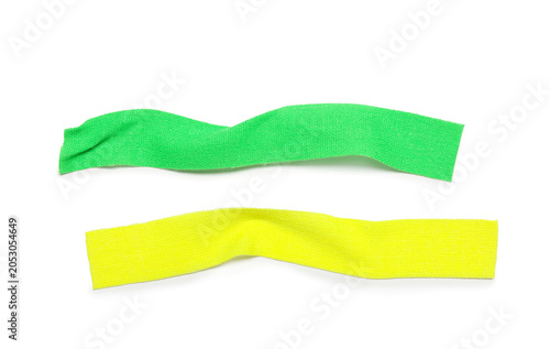 Crumpled strips of green an...