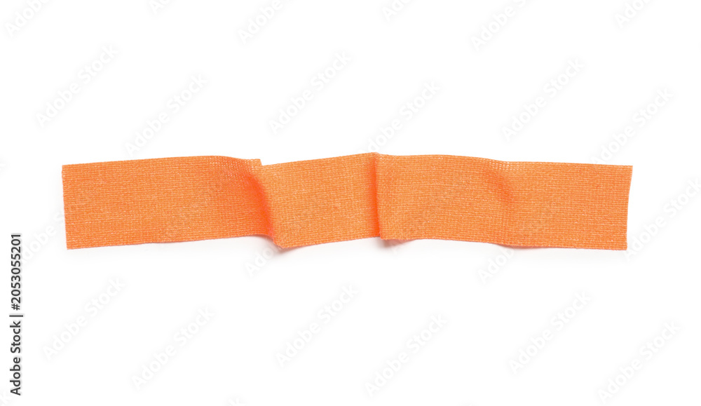 Obraz premium Orange fabric adhesive tape strip on white background
