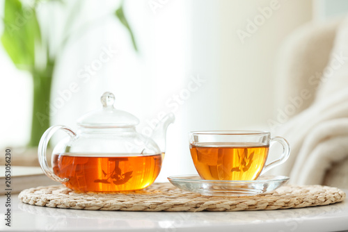 Glass cup and teapot of hot...