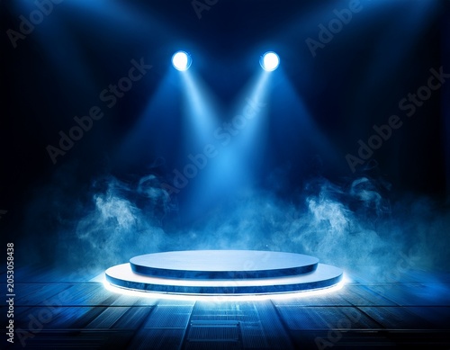 blue stage lights illuminating round platform with smoke effect
