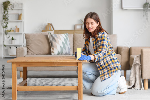 Young happy woman applying ...