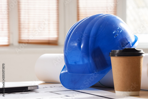 Hardhat with coffee cup and...