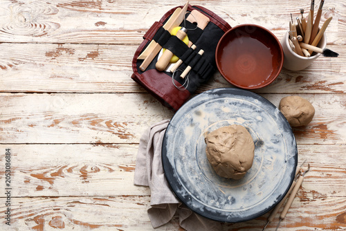 Pottery wheel, clay and scu...