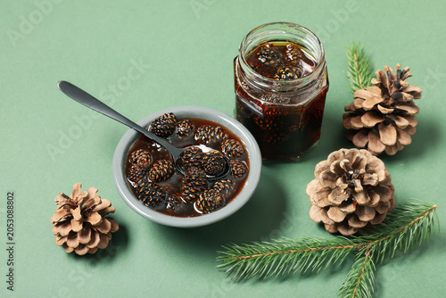 Jar and bowl of tasty pine ...