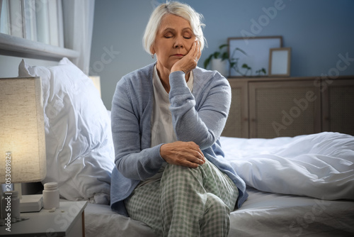 Senior woman suffering from...