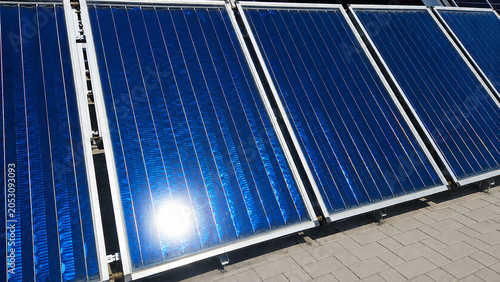 Clean Solar Thermal Panels Reflecting Sunlight on Modern Renewable Energy Installation