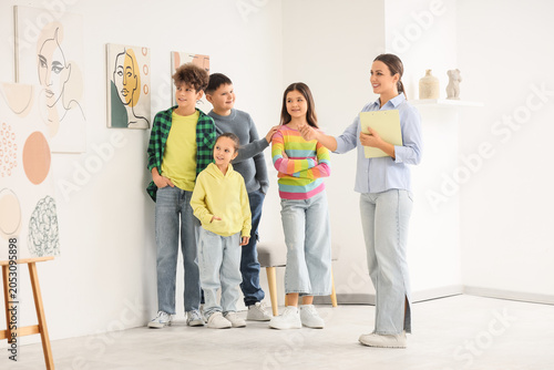 Female guide with children ...