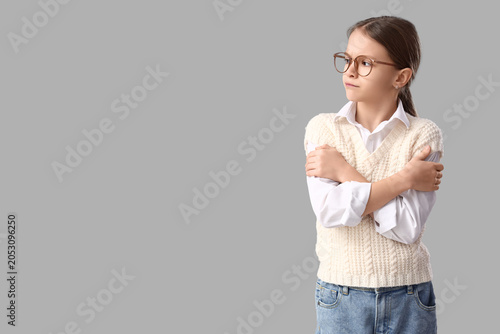Upset girl hugging herself ...