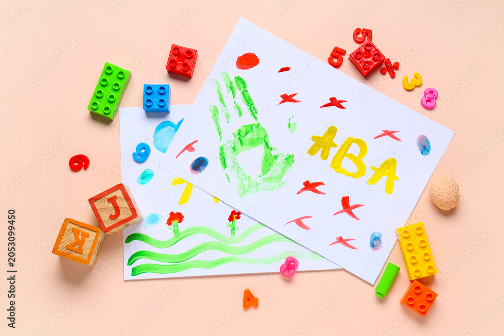 Naklejka premium Children's creative art activity with handprint and colorful drawings, educational playtime for early childhood development