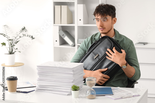 Stressed young businessman ...