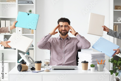 Overwhelmed businessman exp...