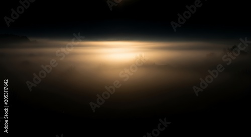 Abstract light streak on a dark background creating a futuristic and energetic visual effect.