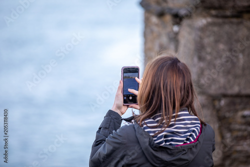 Tourist Photographing Boats at Falmouth Harbour