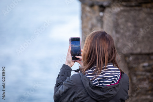 Tourist Photographing Boats at Falmouth Harbour