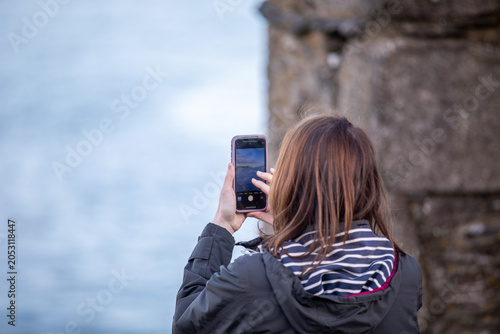 Tourist Photographing Boats at Falmouth Harbour