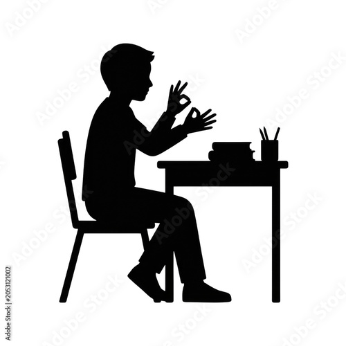 Silhouette of Student Making OK Hand Gesture at Desk