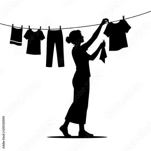 Silhouette of Woman Hanging Laundry on Clothesline with Clothespins