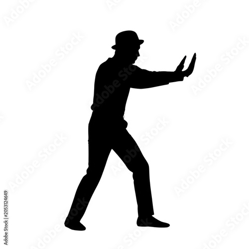 Silhouette of Man in Bowler Hat Pushing or Stopping Motion