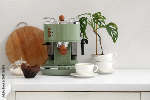 Modern coffee machine, cups...
