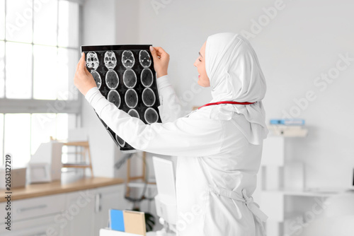 Female Muslim doctor in hij...